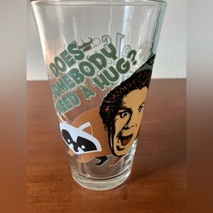 Elf The Movie Drinking Glass 16oz  Will Ferrell Buddy w Raccoon “Need A Hug?”